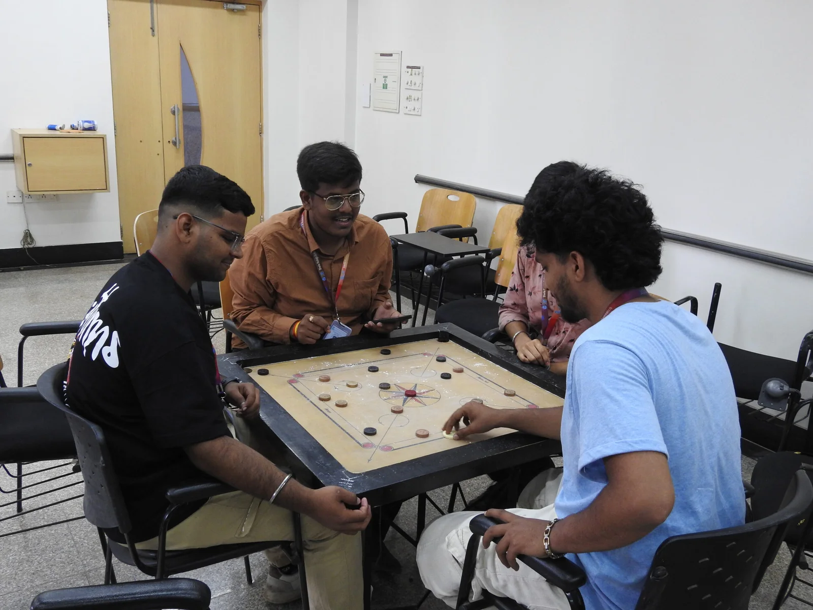 Students Playing carrom board in SRBS