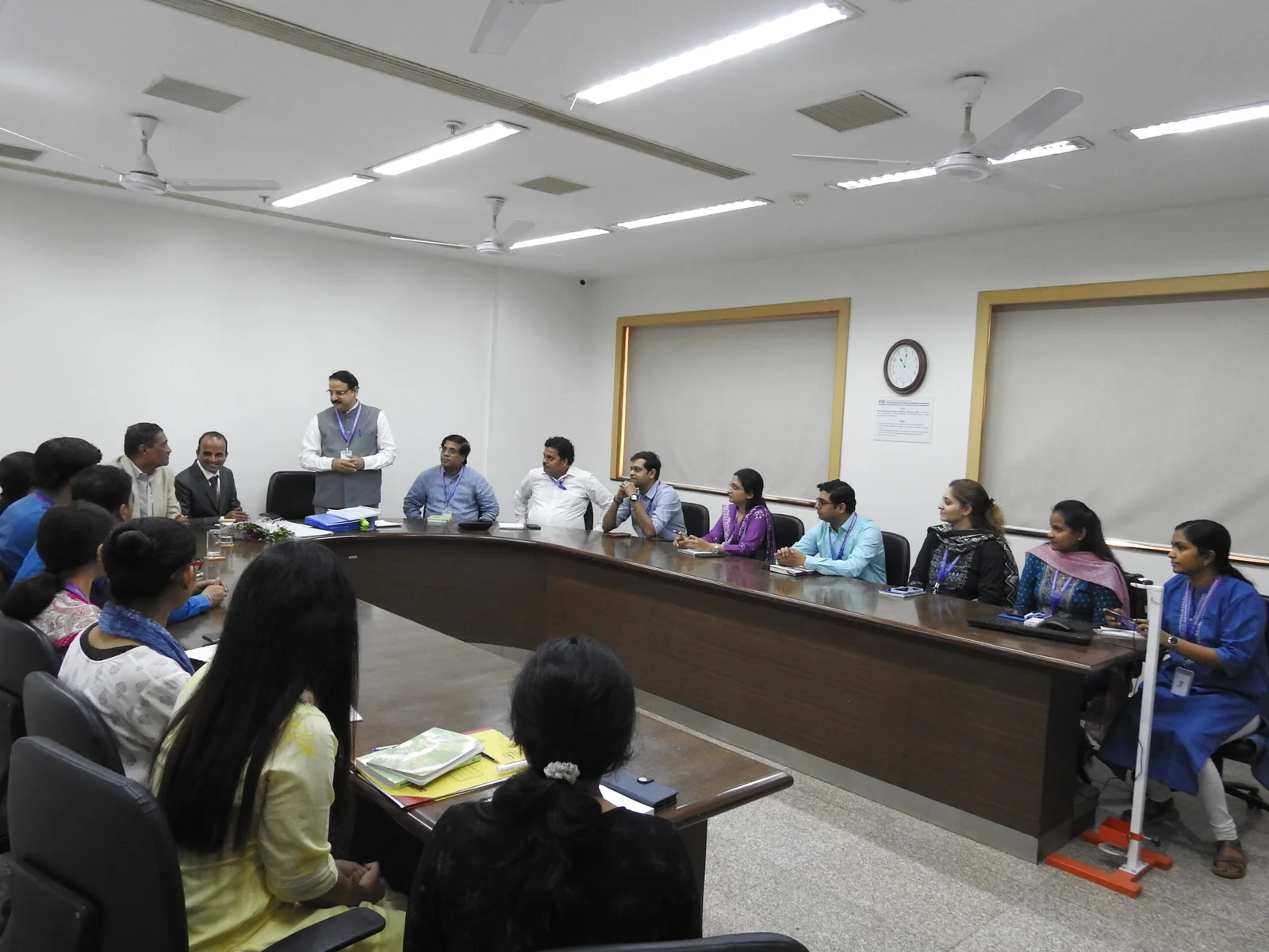 Management and students in conference room SRBS